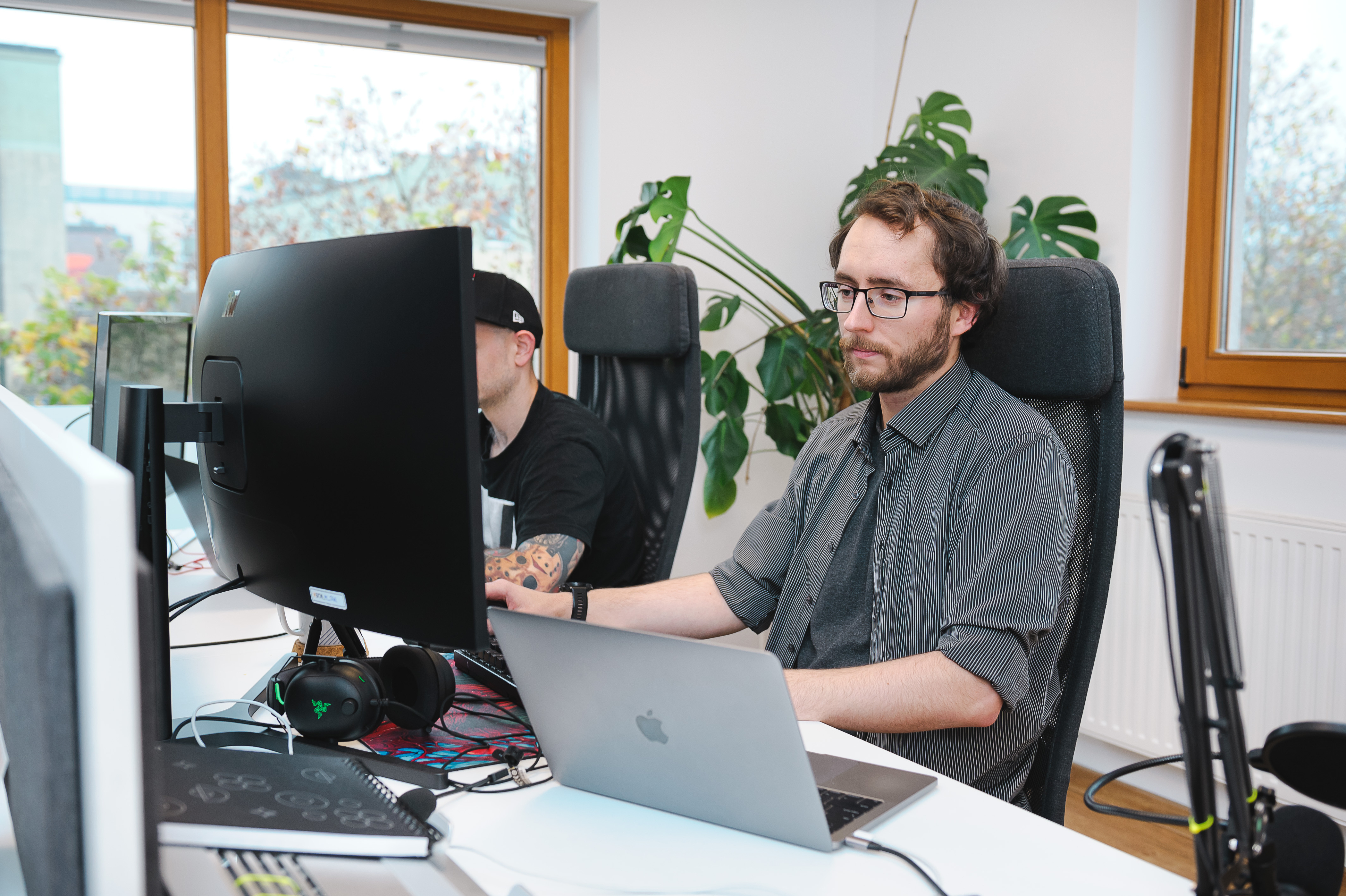 Bitnoise developers collaborating at their workstations