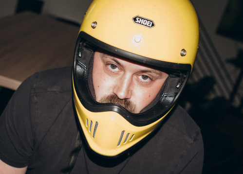 Bitnoise team member wearing a yellow motorcycle helmet